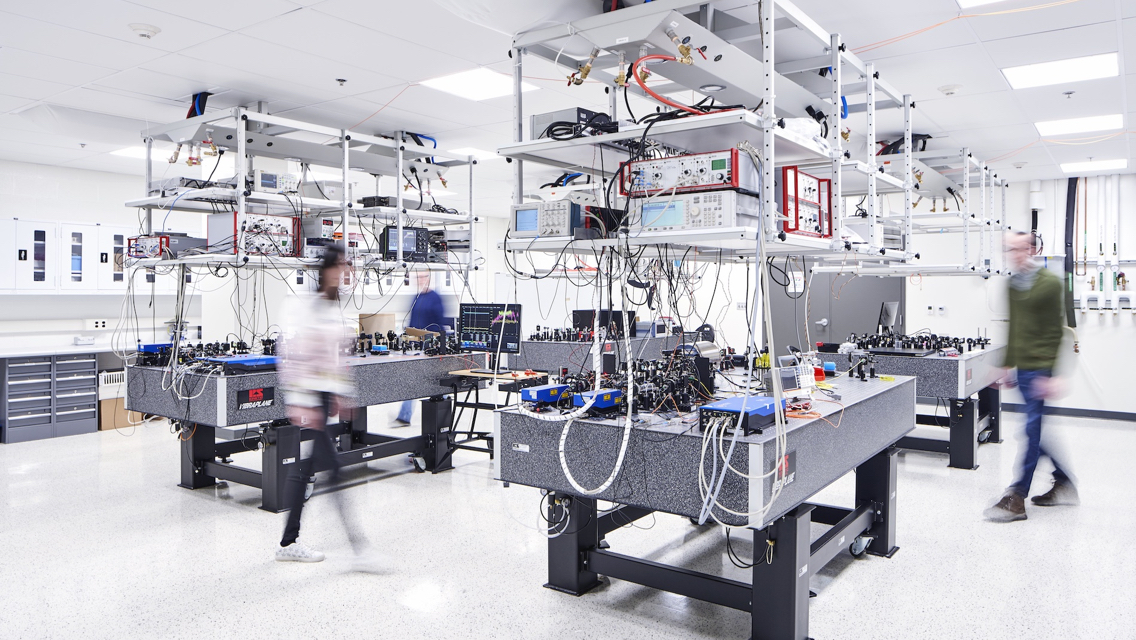 people moving around a high tech lab