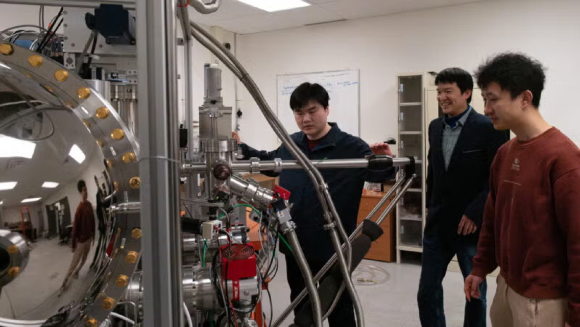 3 people working in a technology lab
